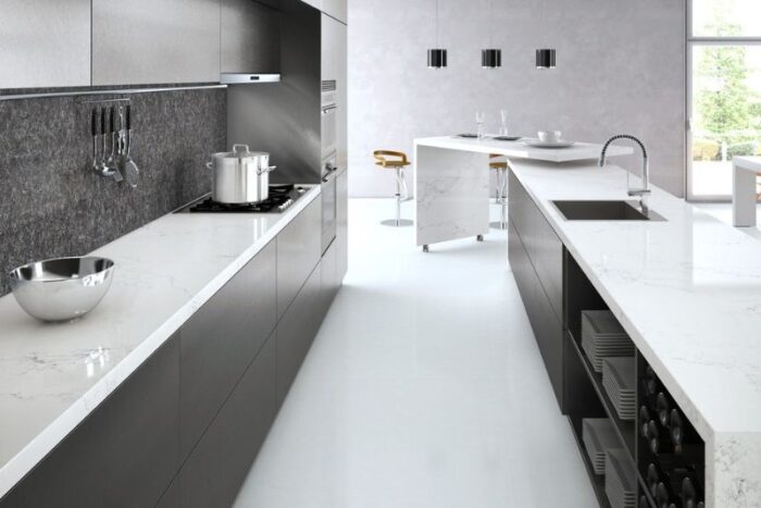 A modern kitchen with white countertops.