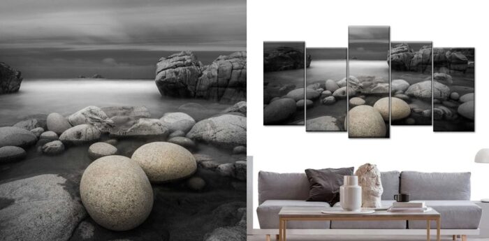A black and white photo of rocks and a living room featuring wall art.