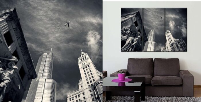 A black and white photo showcasing wall art inside a living room.