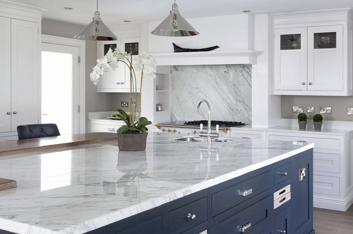 A kitchen with marble counter tops and quartz countertops.