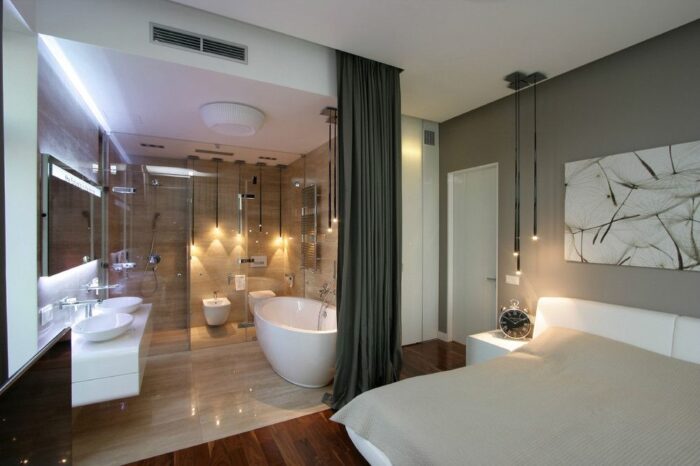 A modern bathroom with a bathtub and shower featuring a stylish bathroom design.