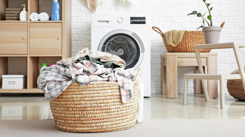 An eco-friendly laundry room with a washing machine for washing clothes.