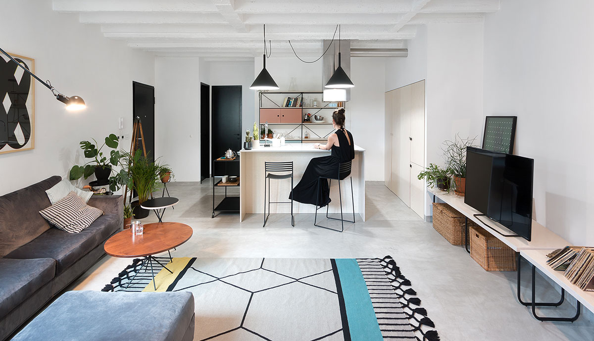 A small apartment with enhanced interiors including a kitchen and living room.