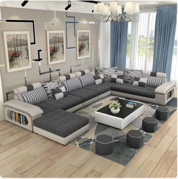Decorate living room with large sectional sofa and coffee table.