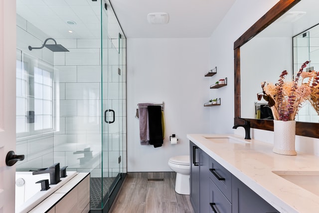 A glass shower and sink make a small bathroom look bigger.