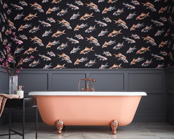 A bathroom with a pink tub and black wallpaper, showcasing a unique bathroom design.