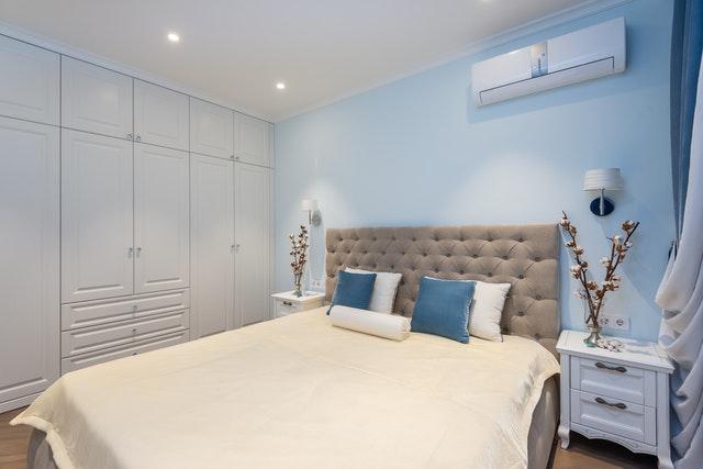 A bedroom with air conditioning