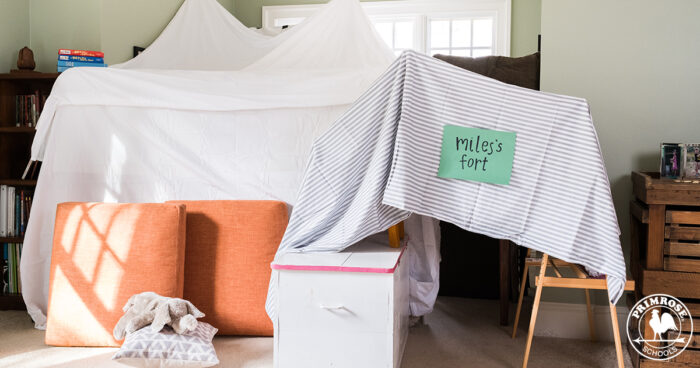 A room designed with activities that will keep kids occupied, including a tent in the middle.
