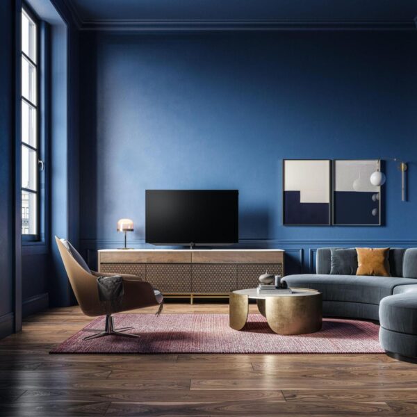A living room with blue walls and furniture showcasing an appealing design.