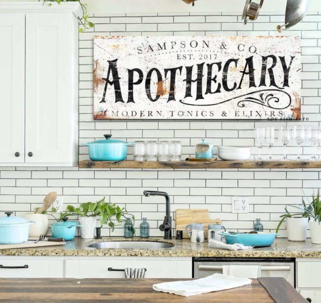 A stunning kitchen with an apothecary sign.