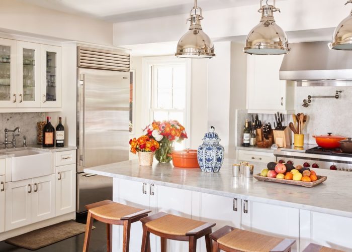 Ways to make a stunning kitchen with a center island and stools.