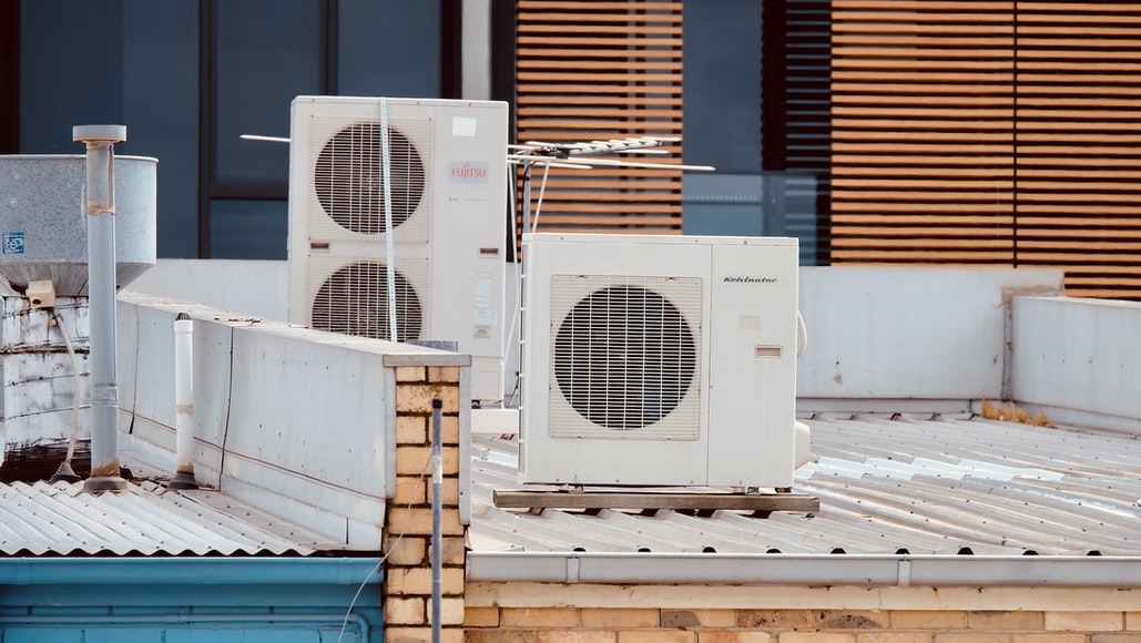 A group of HVAC systems on the roof of a building.