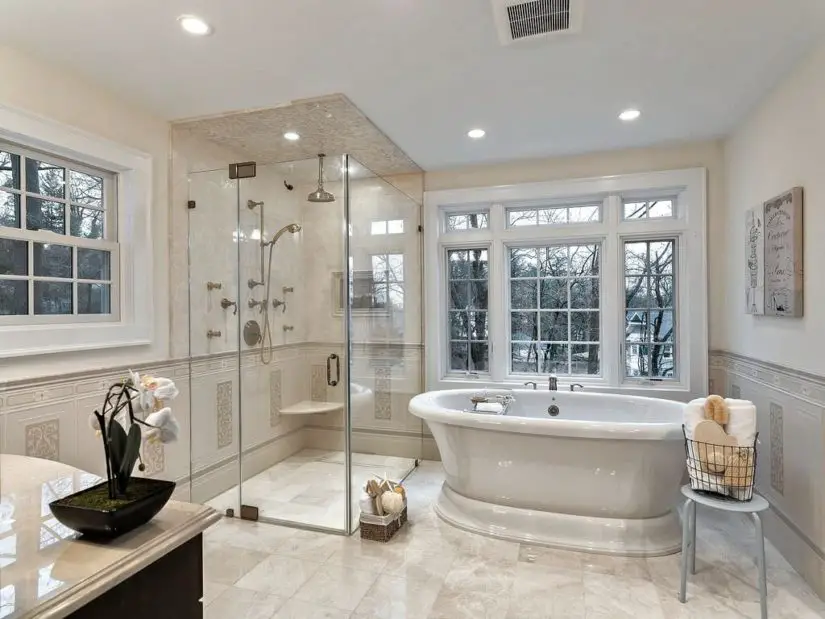 A large bathroom with a large tub and sink.