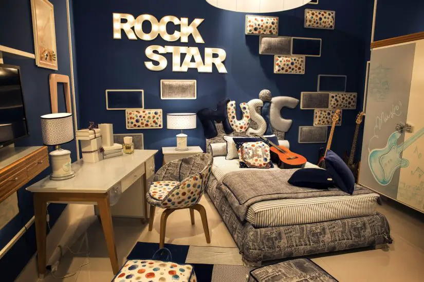 A blue bedroom with a rock star theme.
