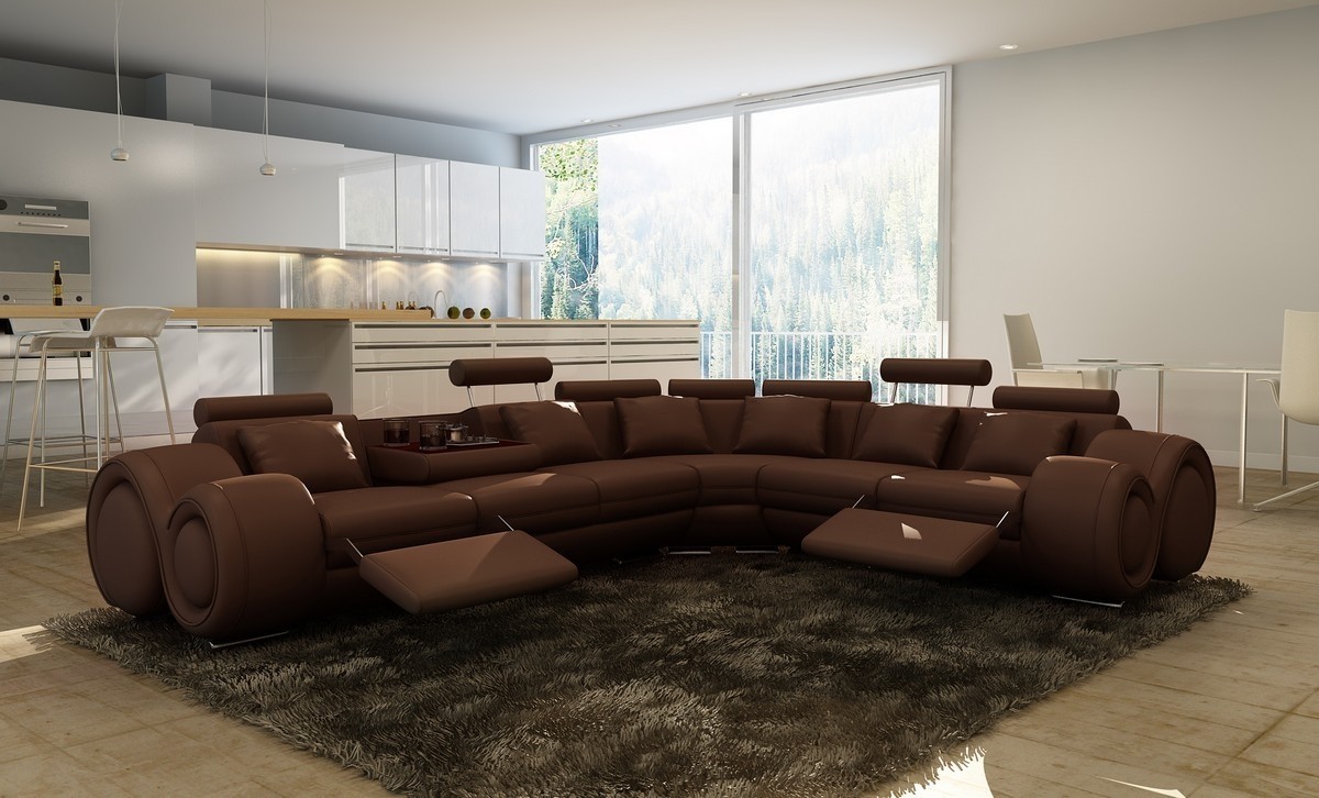 A modern brown leather sectional sofa in a living room.