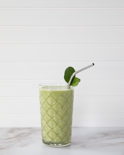 A green smoothie in a glass.