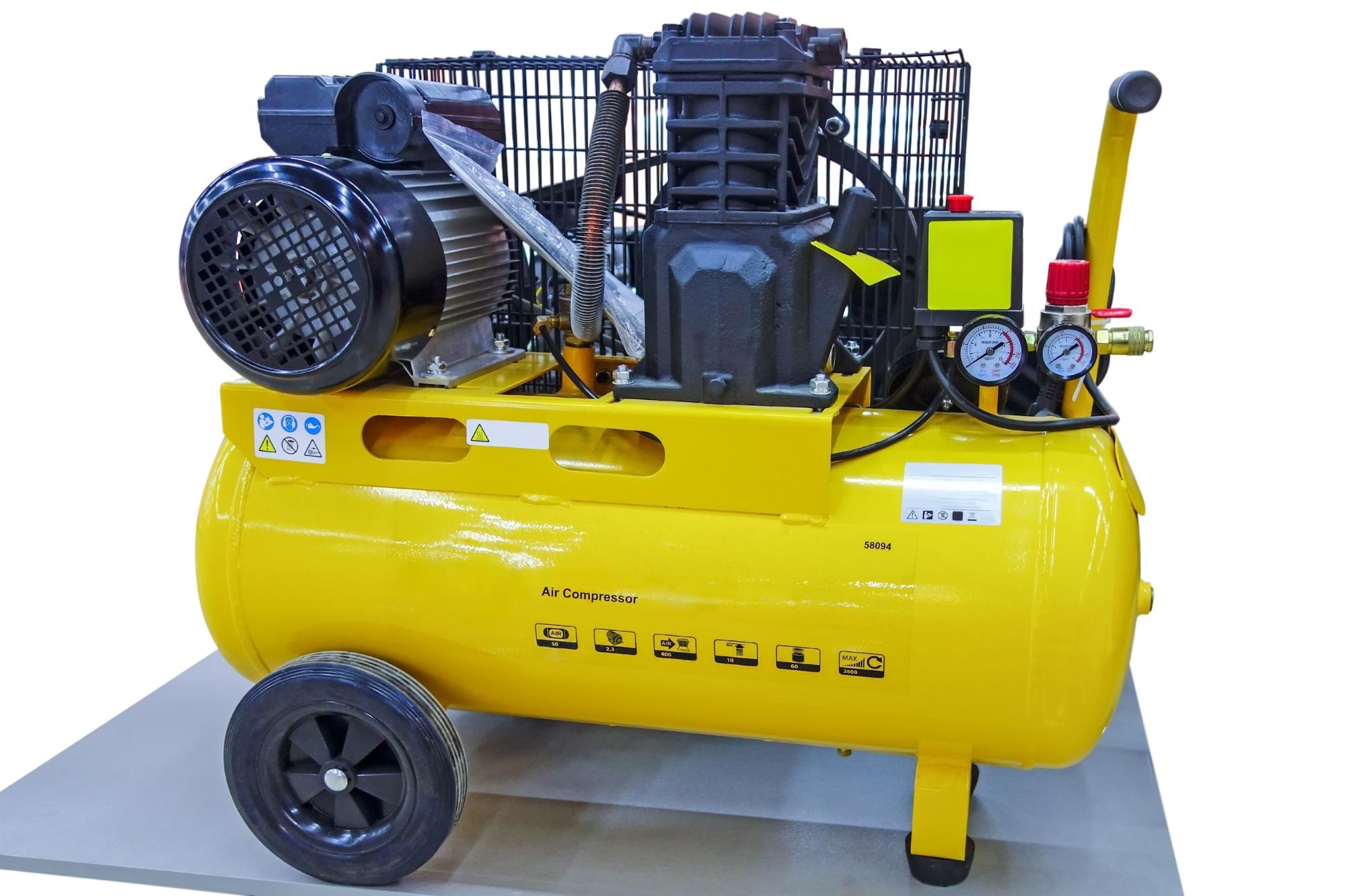 A bright yellow air compressor.