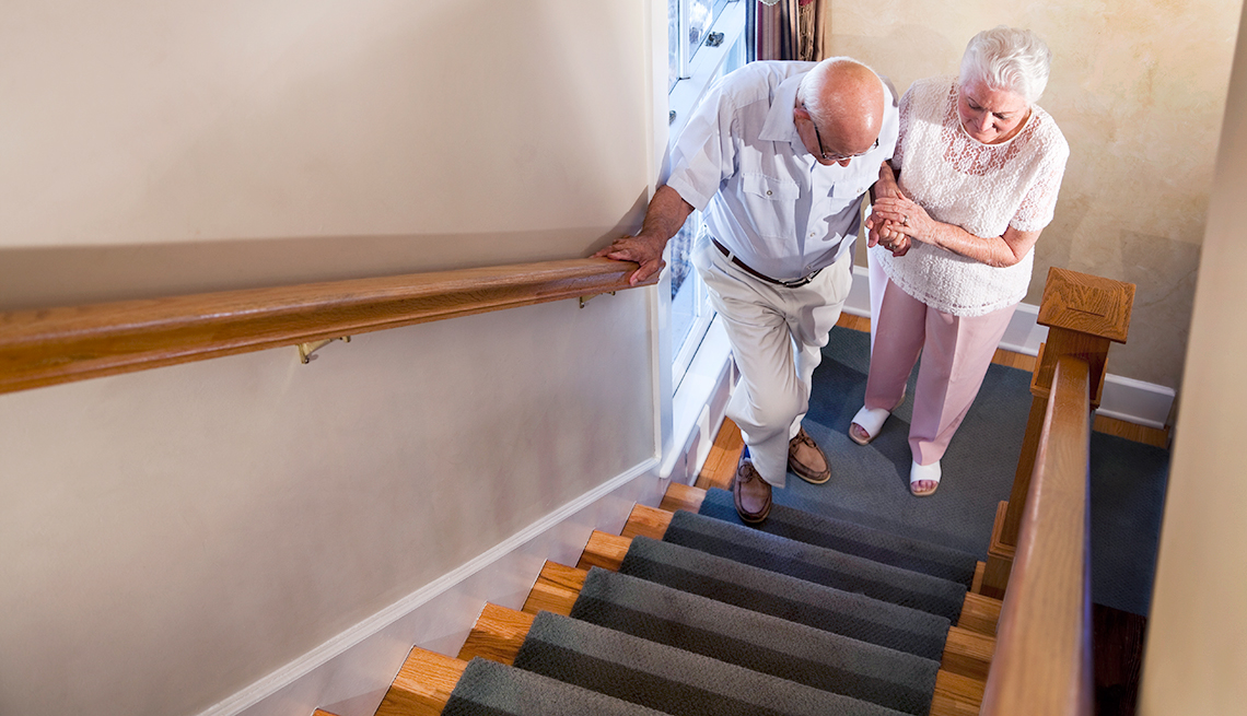Elderly parents climbing stairs.