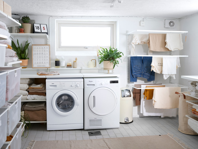 A white washer and dryer in a utility room.