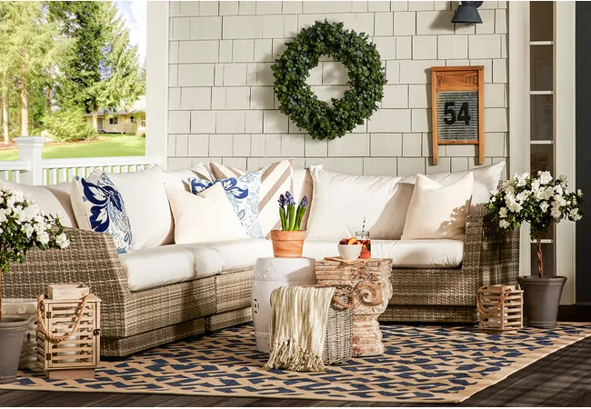 Decorate Your Porch with a Wicker Sectional and Pillows.