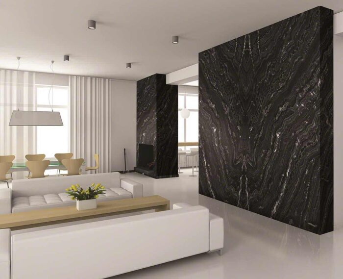 A living room with a black marble wall.