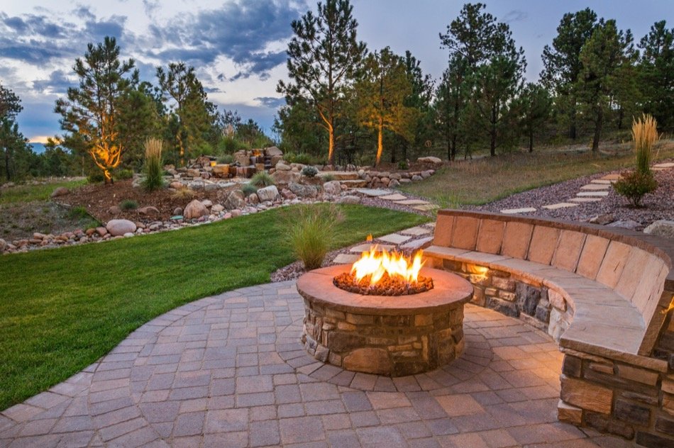 A fire pit enhances the landscape of your backyard.