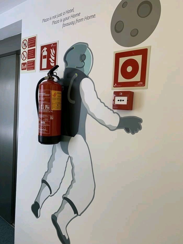 A wall blending survival item art with a fire extinguisher.