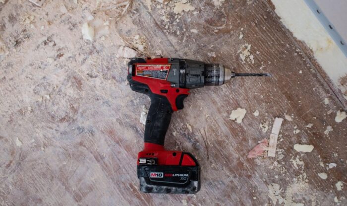A cordless drill is used for a DIY home project.