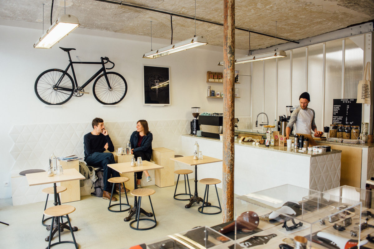 Designing your coffee shop with a bicycle-themed wall.
