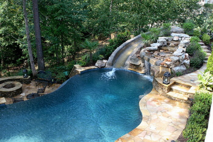 A backyard pool with a waterfall.