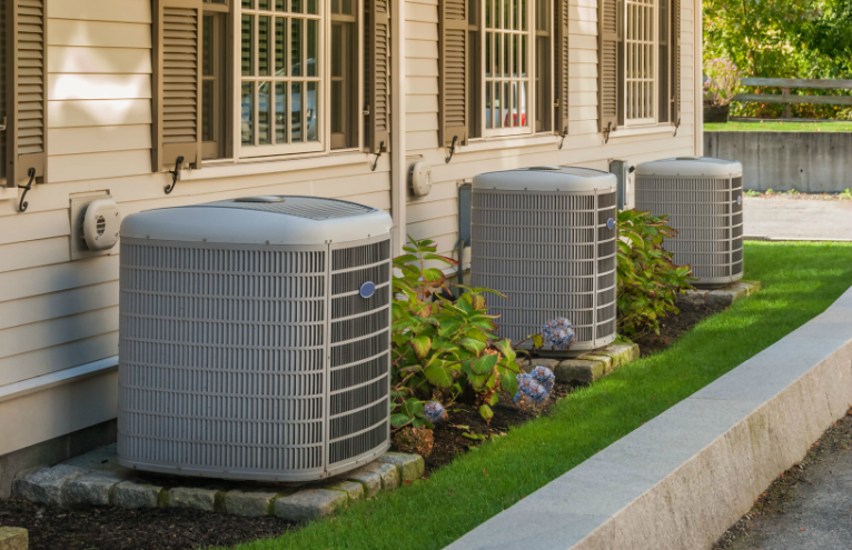 Air Conditioning units in front of a house.