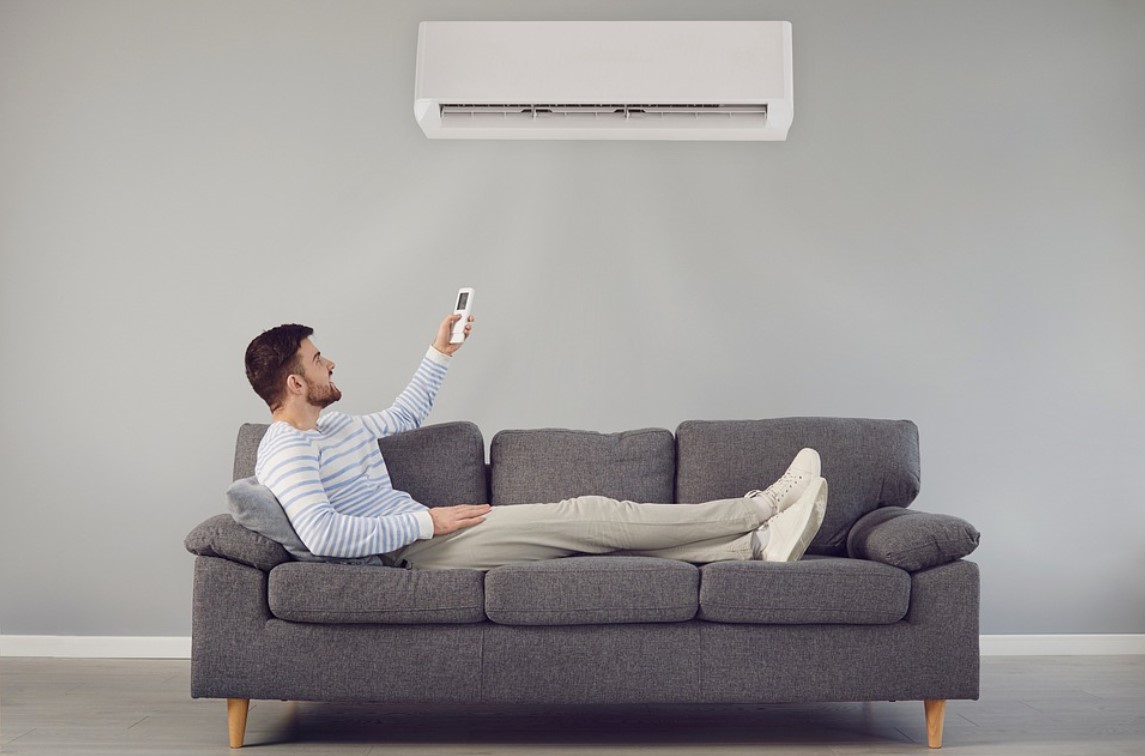 A man using an air conditioner.