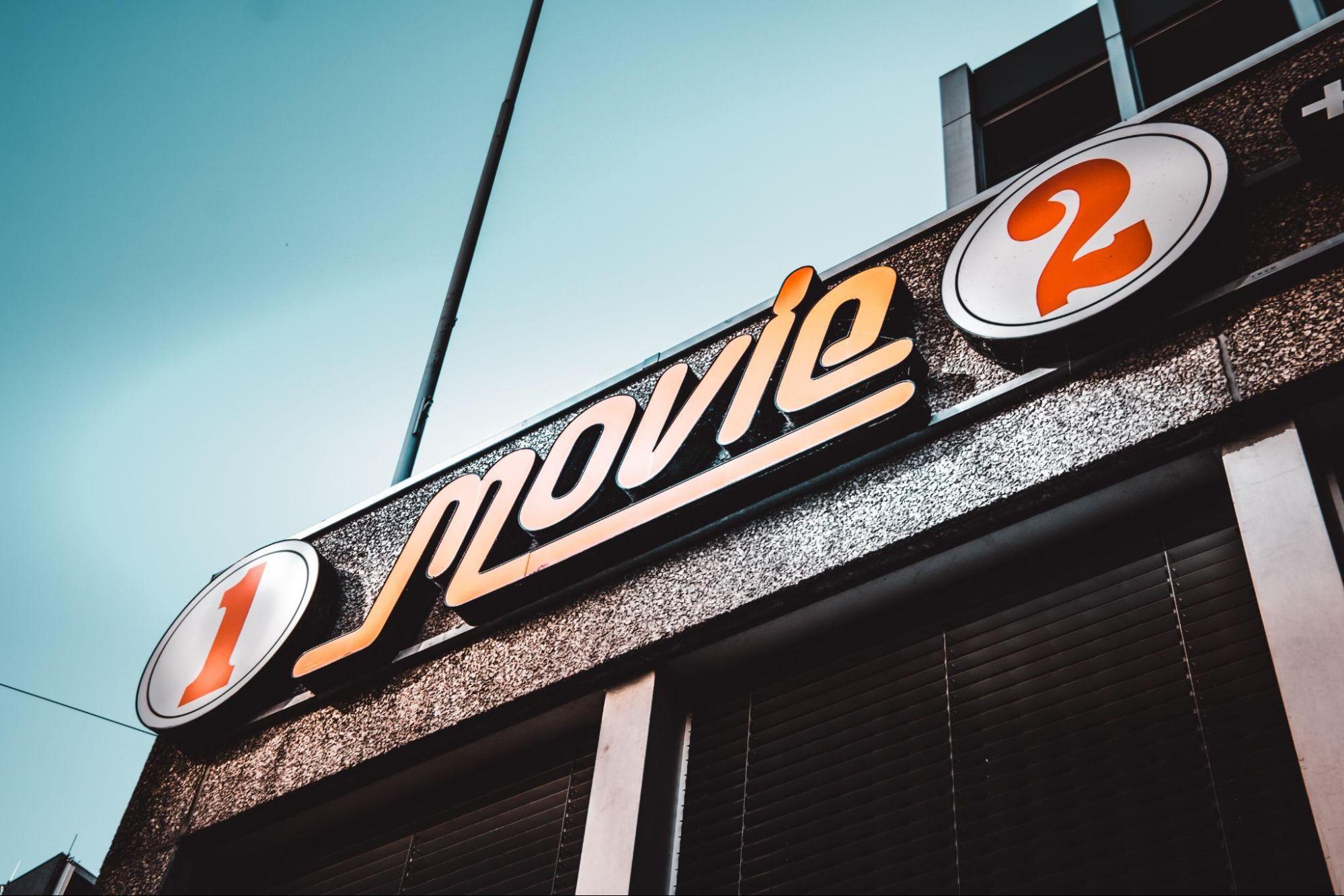 A movie 2 sign on the side of a building for your office.