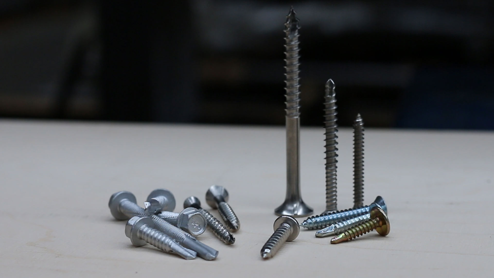 A variety of Self Drilling Screws on a table.