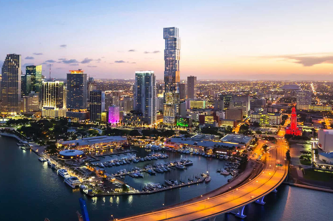 The skyline of Miami at dusk featuring Waldorf Astoria Residence.