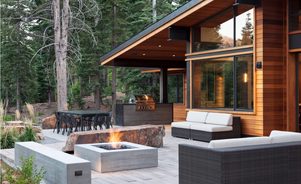 A modern outdoor living area with a fire pit, perfect for Cottage Living.