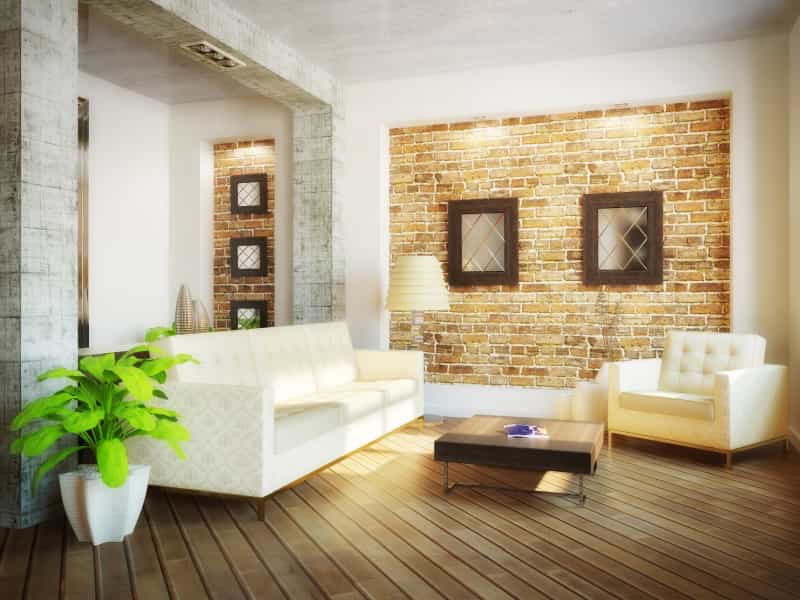 A dream home living room with a brick wall and white furniture.