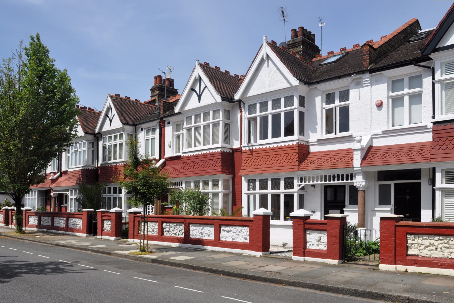 A row of terraced houses in London - Guide To Buying Your First House in London.