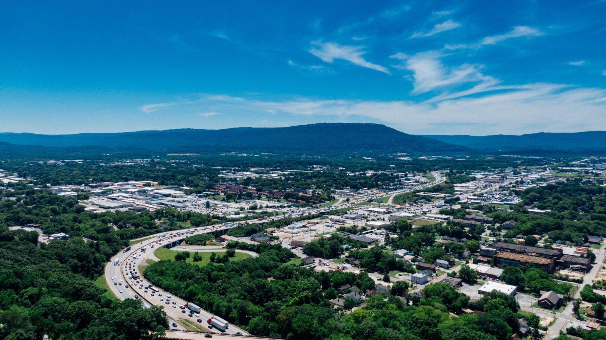 An aerial view of neighborhoods and mountains in Franklin.