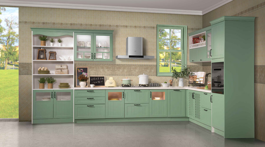A kitchen with green cabinets and counter tops.