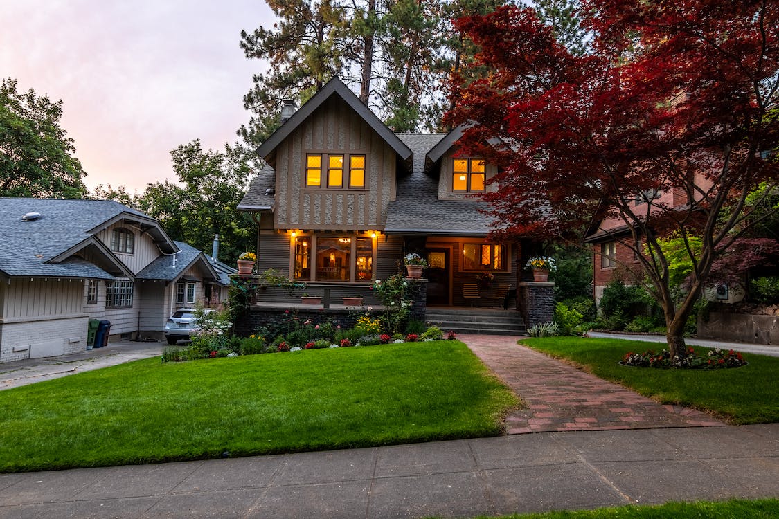 A Tennessee home in a residential neighborhood at dusk.