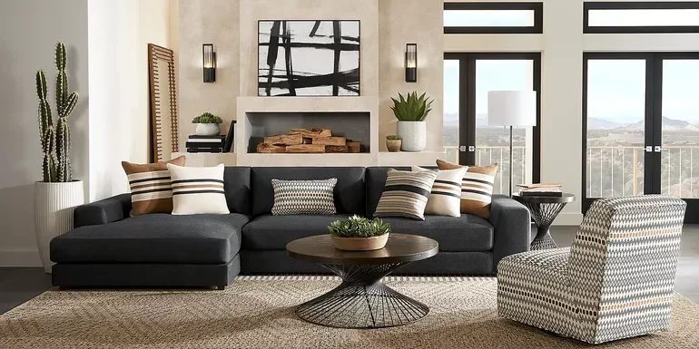 A living room with a black sectional couch and furniture sets.