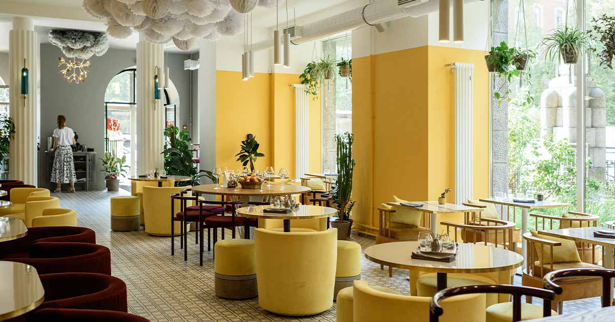 A restaurant with a vibrant design and yellow accents.