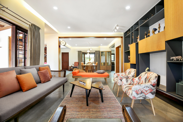 A well-designed living room with a couch and chairs.