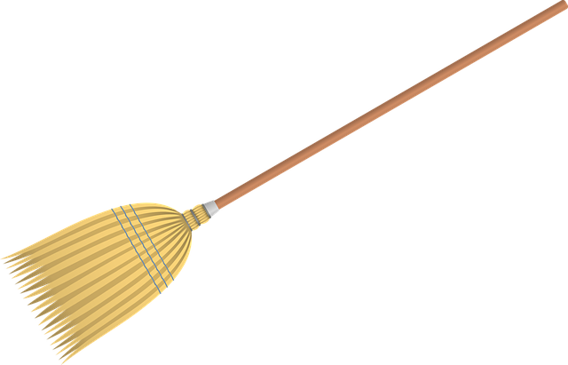 A yellow broom for cleaners on a black background.