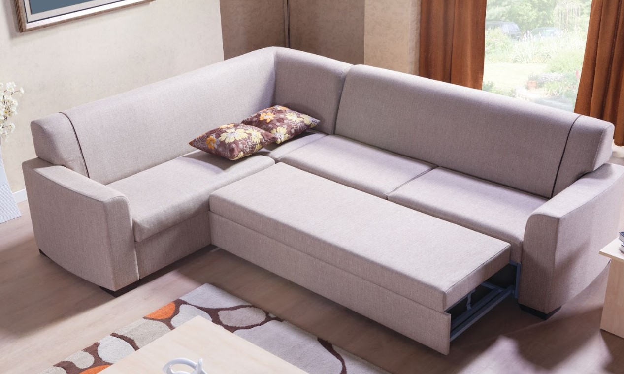 A living room with a multi-functional sectional sofa.