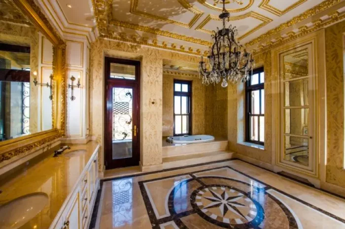 A Glimpse into Palazzo Steyn: A lavishly designed bathroom with marble floors and a chandelier.