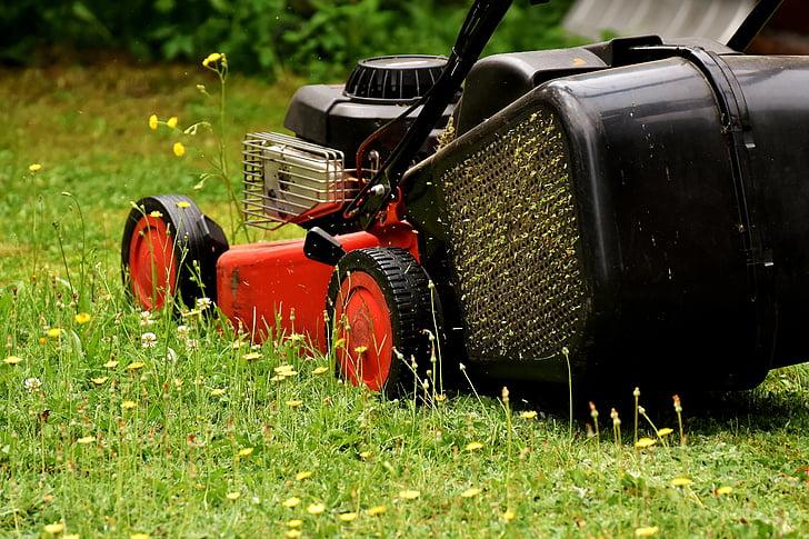 Keywords: grass, lawn mower Modified Description: A lawn mower is parked on the grass.