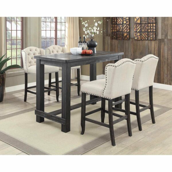 A black and white counter height dining table with four stools.