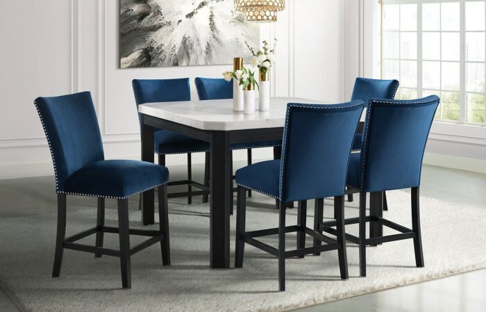 A counter height blue dining room table and chairs.